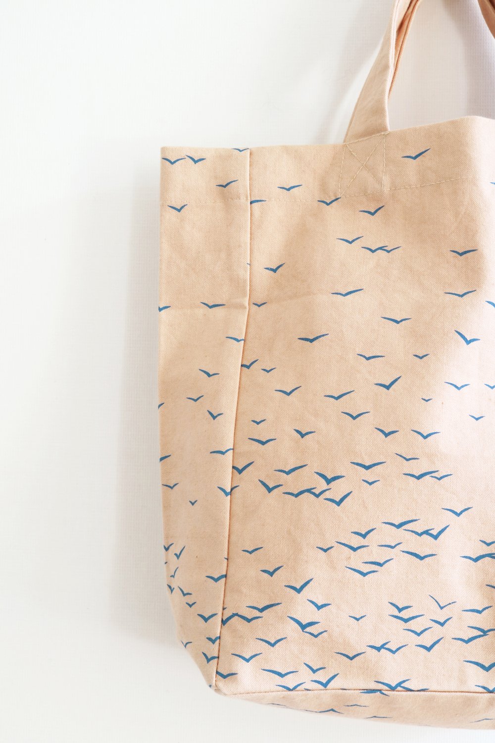 SKY - small fairtrade, organic cotton tote bag in apricot